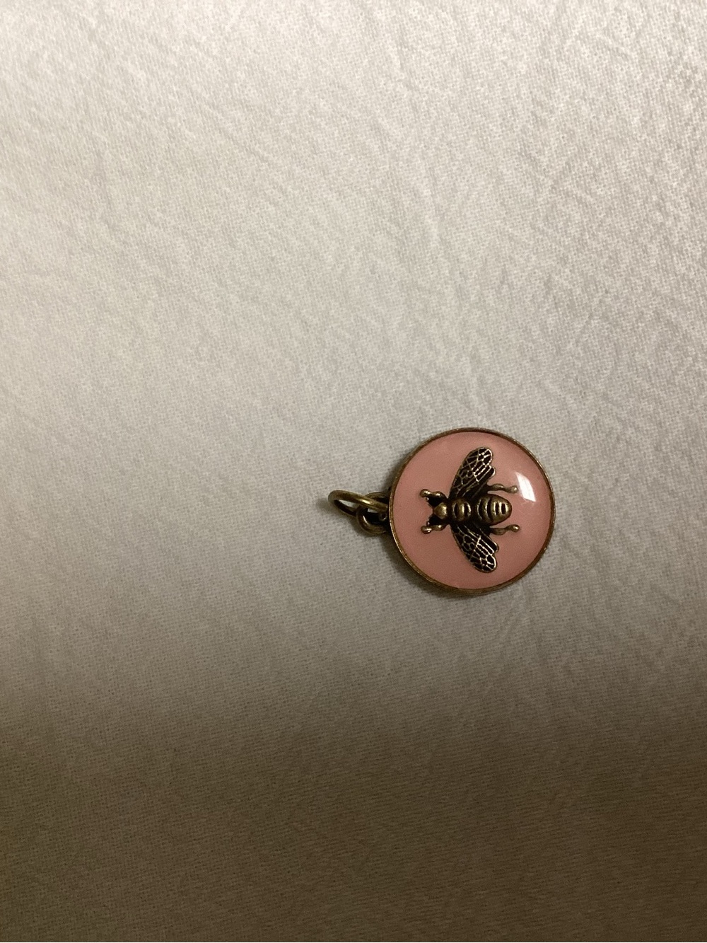 Gucci pink enamel gold bee pendant.